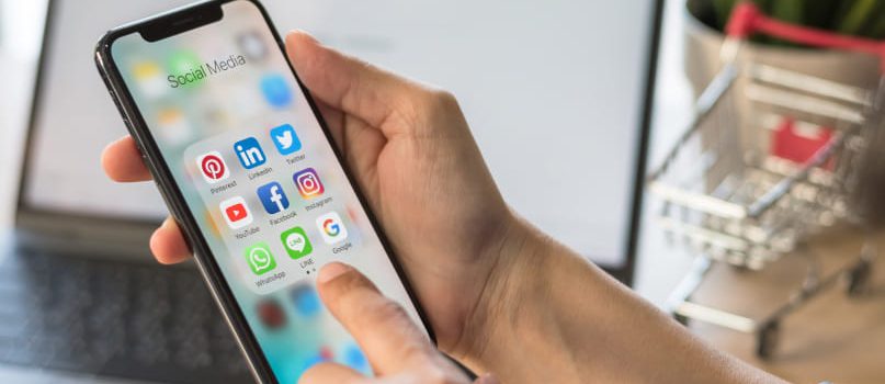 Mobile-app-development-company-services-social-media-marketing A smartphone social media applications tab representing a mobile app development company social media marketing service