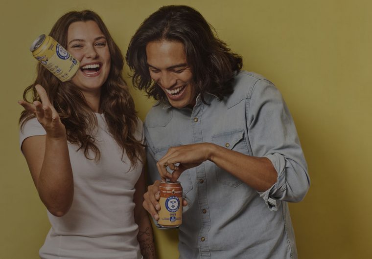 custom-website-design-company-buddha-brands-background-image happy couple holding buddha brands products and laughing
