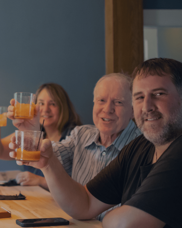 headwaters-tall A family raise their glasses at Headwaters Restaurant & Pub