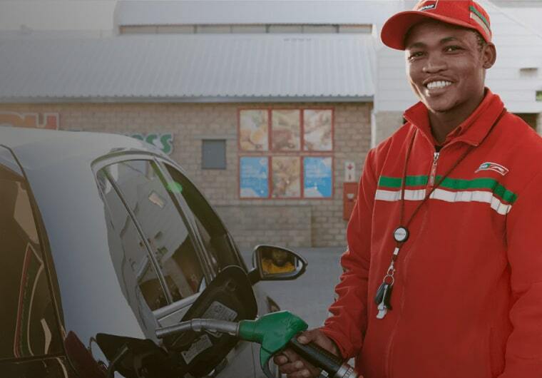 puma-energy-portfolio-background Background image of a man filling up his car with gas for Puma Energy