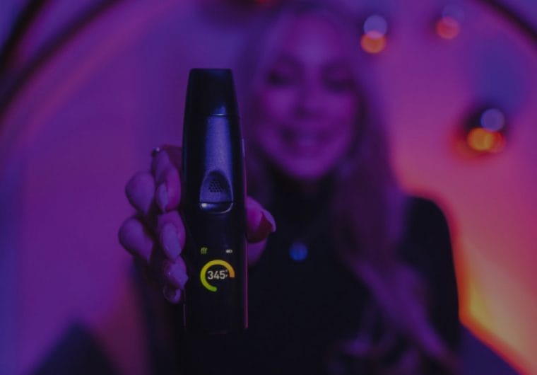 gpen_background_big A woman holds a vape to camera