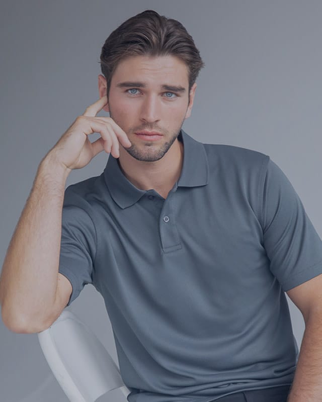 smallwoods-yachtwear-tall A man poses in a grey polo shirt