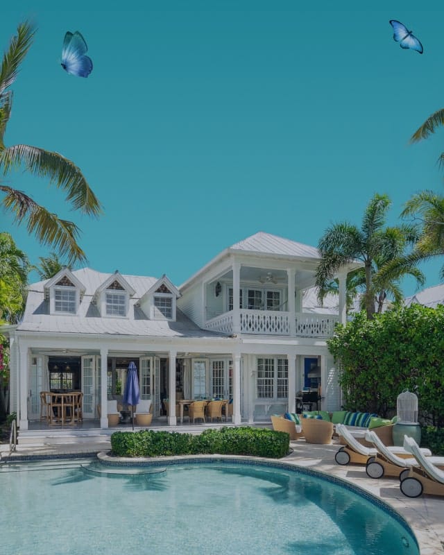 vhokw-background-4 Background image for Vacation Homes Of Key West's case study showing a tropical white house with a pool